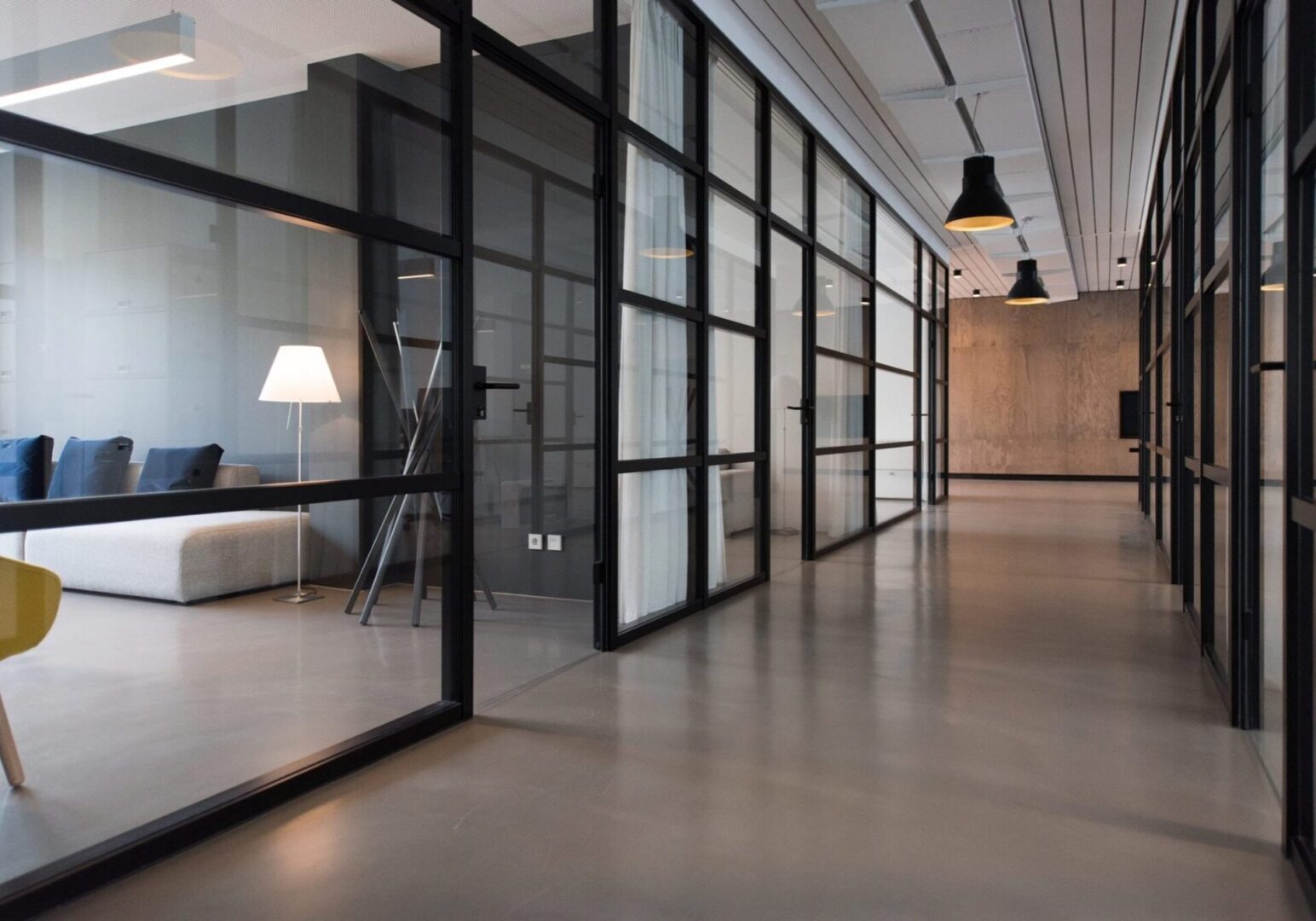A black and white minimalist office corridor